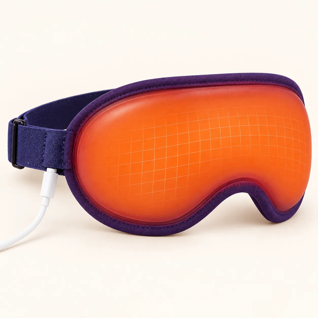 Close-up of the Sleepiti heated eye mask in a neutral studio setting.
